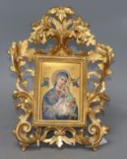 A Continental porcelain icon depicting Madonna and Child, in a Florentine frameCONDITION: Two pieces