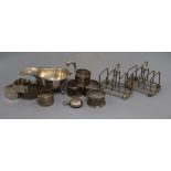 An Egyptian white metal sauceboat, a pair of George V silver toastracks, a late Victorian silver