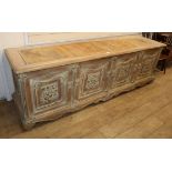 A French provincial chest, the front carved with three foliate panels, W.240cm, D.62cm, H.78cm