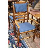 A set of eight 18th century style elm and beech ladderback dining chairs (two with arms)