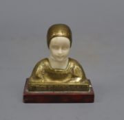 A bronze and ivory bust of a girl, height 8cmCONDITION: There is a small crack to the girl's