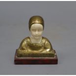 A bronze and ivory bust of a girl, height 8cmCONDITION: There is a small crack to the girl's
