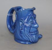 A C.H. Brannam blue glazed 'double mask' jug, height 15cmCONDITION: There is a glazed chip to the