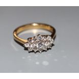 A modern 18ct gold and diamond cluster ring, size M, gross 3.2 grams.CONDITION: No visible damage to