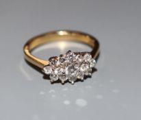 A modern 18ct gold and diamond cluster ring, size M, gross 3.2 grams.CONDITION: No visible damage to