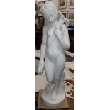 A marble figure of a nude female, a bird on her shoulder, signed 'Bouzadou' (?), height 75cm