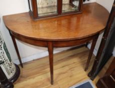 A pair of George III mahogany D shaped tables, W.114cm, D.60cm, H.76cm