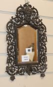 A pewter finish wall mirror, W.24cm., H.38cm