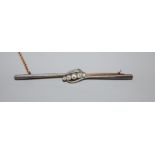 An early 20th century 15ct and graduated five stone diamond set bar brooch, 76mm, gross weight 5.7