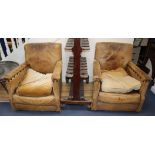 A pair of 1940's French tan leather club armchairs, W.77cm, D.74cm, H.84cm