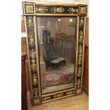 A Regency style 'Empire' wall mirror, W.95cm H.157cm Condition report: The frame has been re-painted