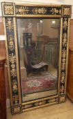 A Regency style 'Empire' wall mirror, W.95cm H.157cm Condition report: The frame has been re-painted