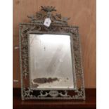 A cast metal easel mirror, W.38cm H.58cm Condition:The frame has an aged paint effect, the