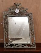 A cast metal easel mirror, W.38cm H.58cm Condition:The frame has an aged paint effect, the