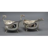 A pair of mid 20th century silver sauceboats, with flying scroll handles, I.S. Freeman & Co, London,