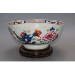 An 18th century Chinese verte Imari bowl on wood stand, c.1740, diameter 26cmCONDITION: There is a