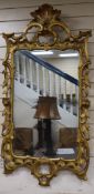 A George III carved giltwood wall mirror, W.65cm., H.130cm