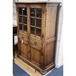 An 18th century style oak dresser with glazed upper section, W.104cm., D.45cm., H.152cm.