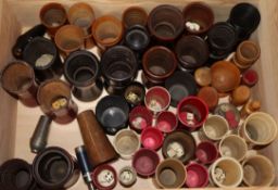 A collection of 19th century ivory, bone and treen etc. dice shakers and containers, many with