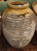 A glazed earthenware oil jar, H.88cm