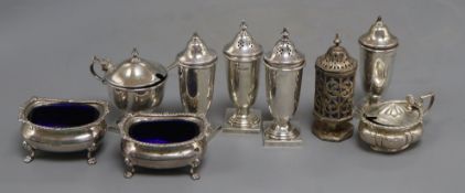 A set of four silver condiments, Sheffield, 1936, 95mm and five other assorted silver condiments.