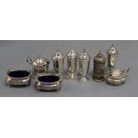 A set of four silver condiments, Sheffield, 1936, 95mm and five other assorted silver condiments.