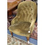 A Victorian spoonback chair upholstered in buttoned fabric