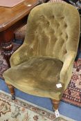 A Victorian spoonback chair upholstered in buttoned fabric