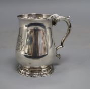 An early George III small silver baluster mug, with later engraved monogram, William Cripps, London,