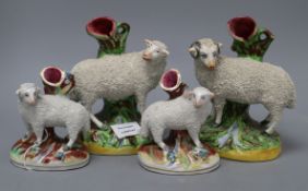 Two pairs of Staffordshire sheep, tallest 18cmCONDITION: All heavily crazed, particularly to the