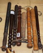 Seven treen truncheons and cocus wood priest, longest 48cmCONDITION: The painted example has lost