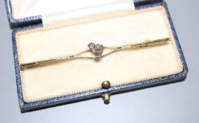 An early 20th century yellow metal and rose cut diamond set 'chick' bar brooch, 65mm, gross 5