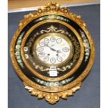 An ornate gold and floral painted electric wall clock, W.48cm H.68cmCONDITION: Two of the numbers