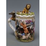 A Doccia Capo di Monte-style lidded tankard and cover, height 20cmCONDITION: Lion has been broken