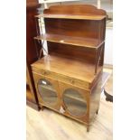 A small Regency mahogany chiffonier, W.69cm D.32cm H.130cm Condition: The top tier has many water