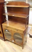 A small Regency mahogany chiffonier, W.69cm D.32cm H.130cm Condition: The top tier has many water