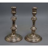 A pair of silver candlesticks of plain baluster form, William Comyns & Sons, London 1975, H 20cm,