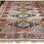 A Bokhara red ground carpet, (badly worn) 330 x 270cm