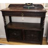 A late Victorian carved oak buffet, W.102cm, D.45cm, H.115cm.