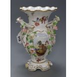 A late 19th century English bone china double handled vase, encrusted with flowers and having