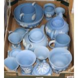 A collection of Wedgwood pale blue ground Jasperware, including two teapots, two covered sugar