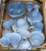 A collection of Wedgwood pale blue ground Jasperware, including two teapots, two covered sugar