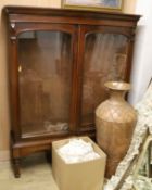 A Victorian mahogany bookcase cabinet on stand, W.138cm