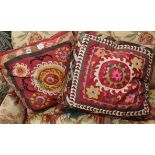 Two Uzbek fabric covered cushions, largest 60cm sq.