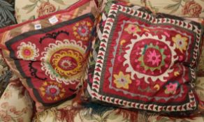 Two Uzbek fabric covered cushions, largest 60cm sq.