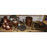 A collection of metalware, including a set of four graduated copper measuring jugs