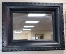 A rectangular grey painted wall mirror, 89 x 69cm.