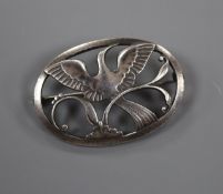 A post 1945 Georg Jensen 925 pierced oval brooch, decorated with a bird in flight, design no. 238,