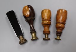 Three 19th century lignum vitae handled desk seals and a black glass handled seal 8 - 10cm