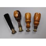 Three 19th century lignum vitae handled desk seals and a black glass handled seal 8 - 10cm